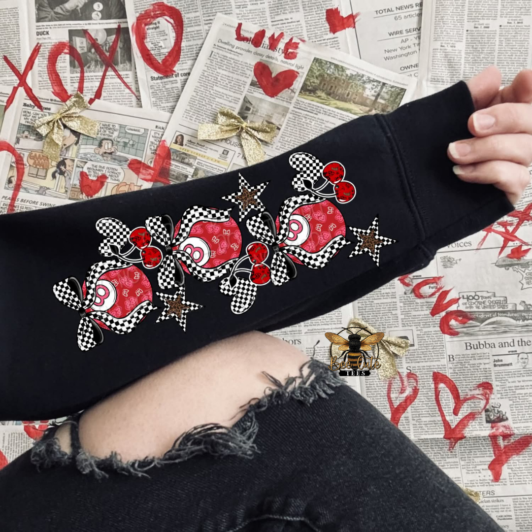 Black sweatshirt with red and white pattern on a newspaper background