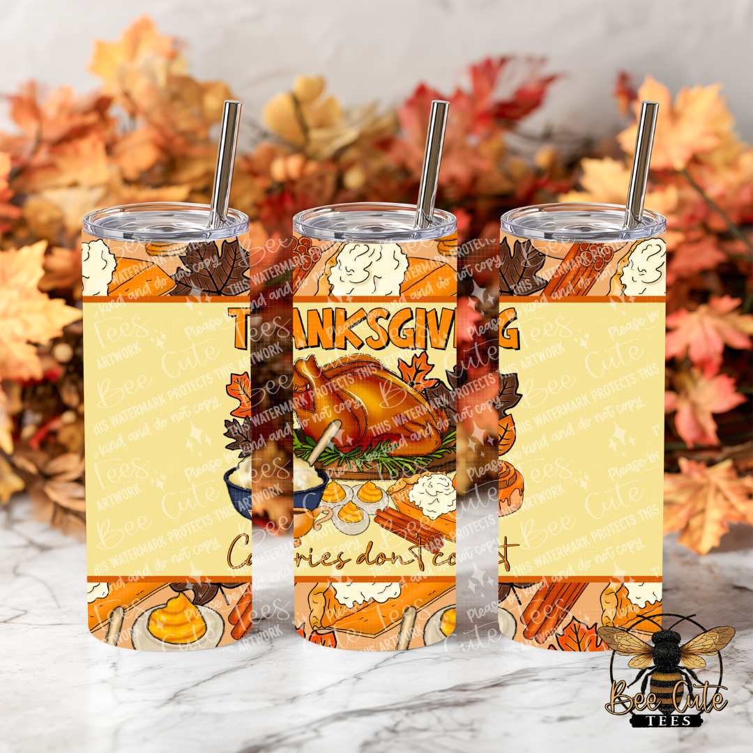Three clear tumblers with metal straws and a Thanksgiving-themed wrap design, shown on a marble surface with autumn leaves in the background. The design features a turkey, corn, pumpkins, and the word Thanksgiving on a pale yellow background.