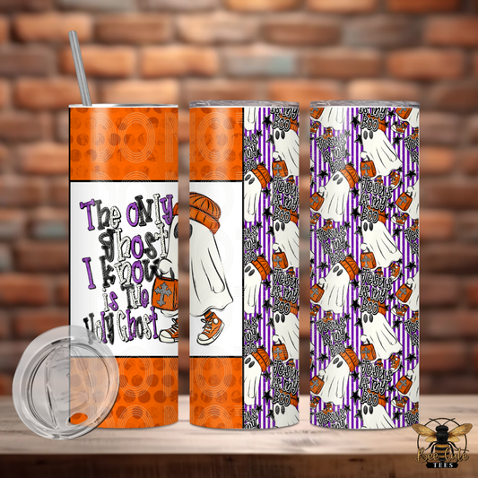 Three views of a skinny tumbler with a Halloween-themed wrap design, featuring orange, purple, white, and black graphics including ghosts, pumpkins, and the text 'The only ghost I know is to yourself'. A clear lid is shown in the bottom left, all set against a rustic brick wall background.