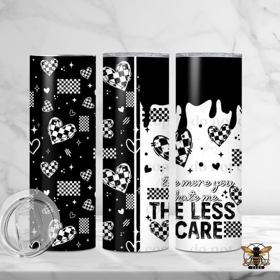Three tumblers with black and white designs on a white background