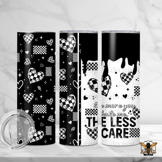 Three tumblers with black and white designs on a white background