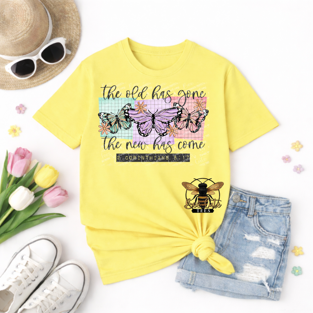 Yellow t-shirt with butterfly design and text, sunglasses, tulips, and shorts on a white background