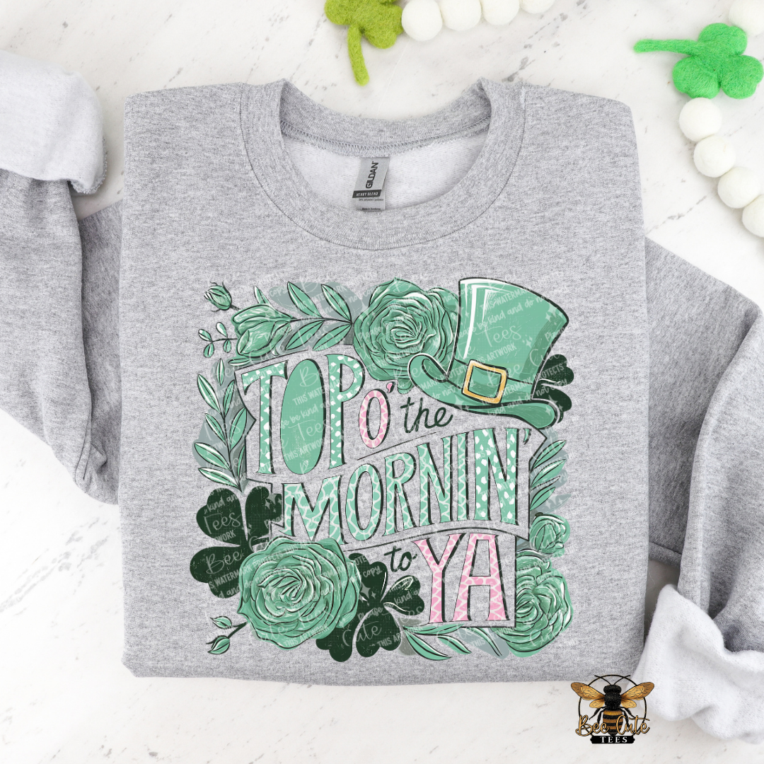 Gray sweatshirt with green floral design and text on a white background