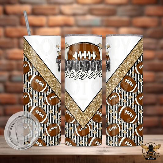 Three views of a skinny tumbler with a football-themed design, featuring brown footballs, black and white stripes, a gold glitter chevron, and the text 'Touchdown Season'. A clear lid and a metal straw are shown alongside the tumbler on a wooden surface with a brick wall background.