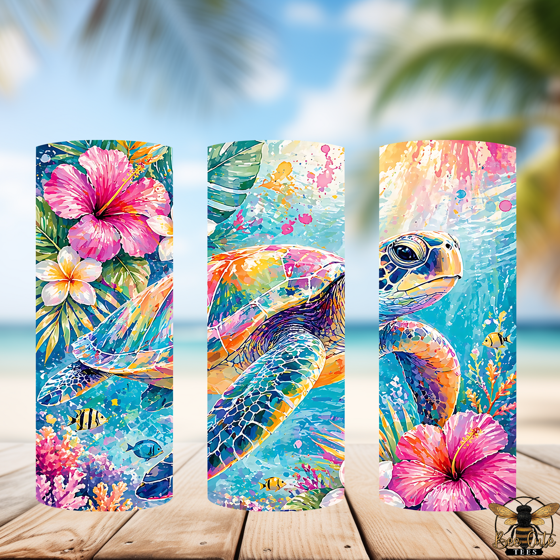 Three colorful beach-themed tumblers with flowers and a turtle on a wooden surface.