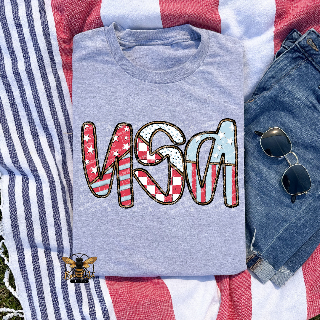 Gray t-shirt with 'USA' design on an American flag background