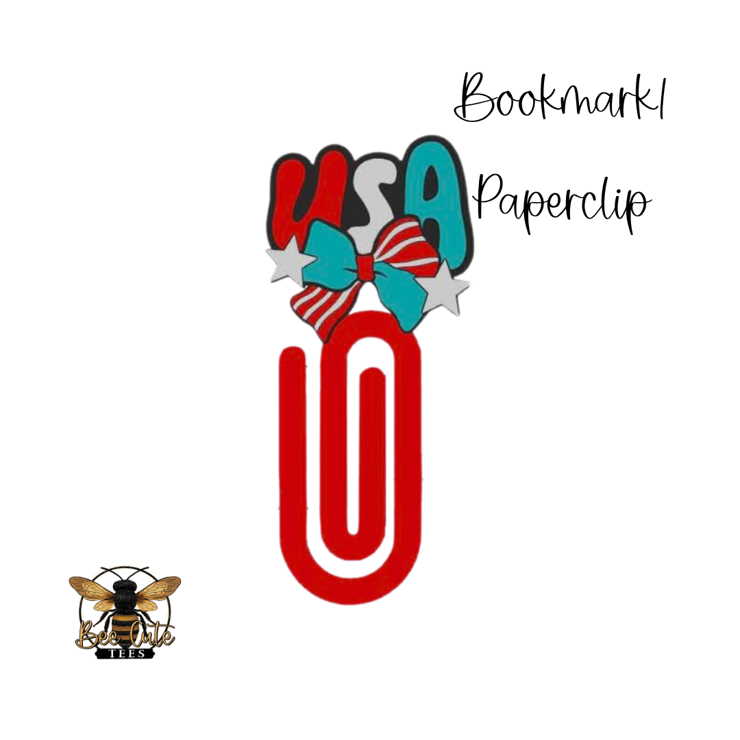 Red paperclip with a bow and 'USA' text on a white background