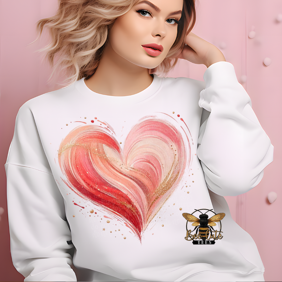 Woman wearing a white sweatshirt with a pink heart design and a bee logo on a pink background