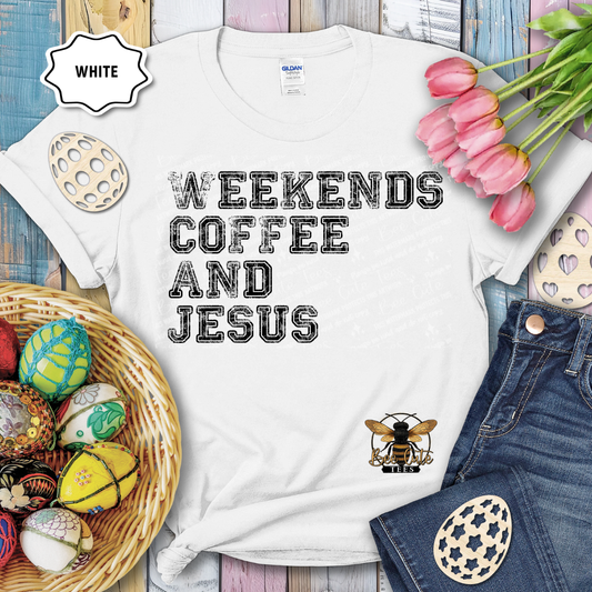 White t-shirt with 'Weekends Coffee and Jesus' text and bee graphic, surrounded by Easter eggs and tulips.