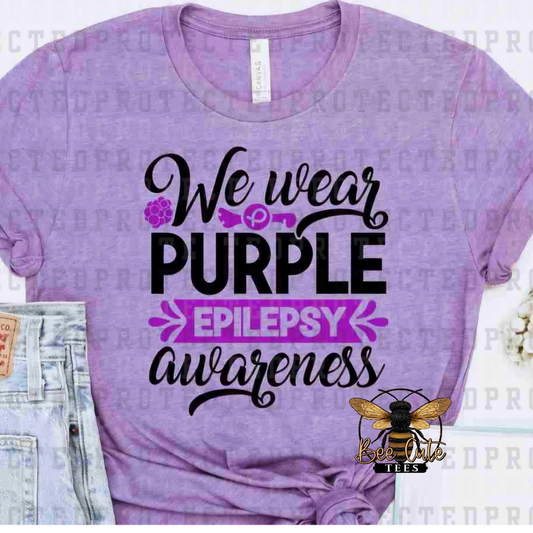 Purple t-shirt with 'We wear purple epilepsy awareness' text on a white background