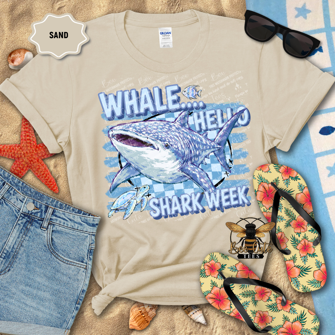 A beige Gildan t-shirt with a 'WHALE.