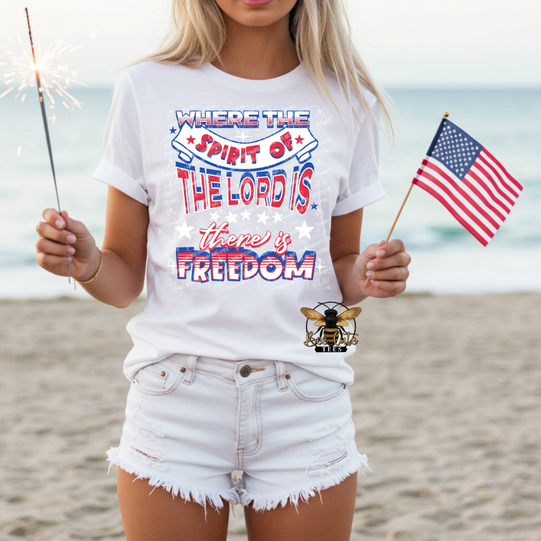 Person wearing a white t-shirt with a patriotic quote on a beach