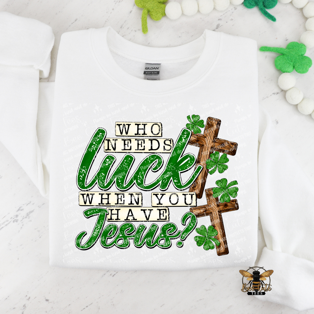 White sweatshirt with 'Who needs luck when you have Jesus?' text and cross design on a white background.