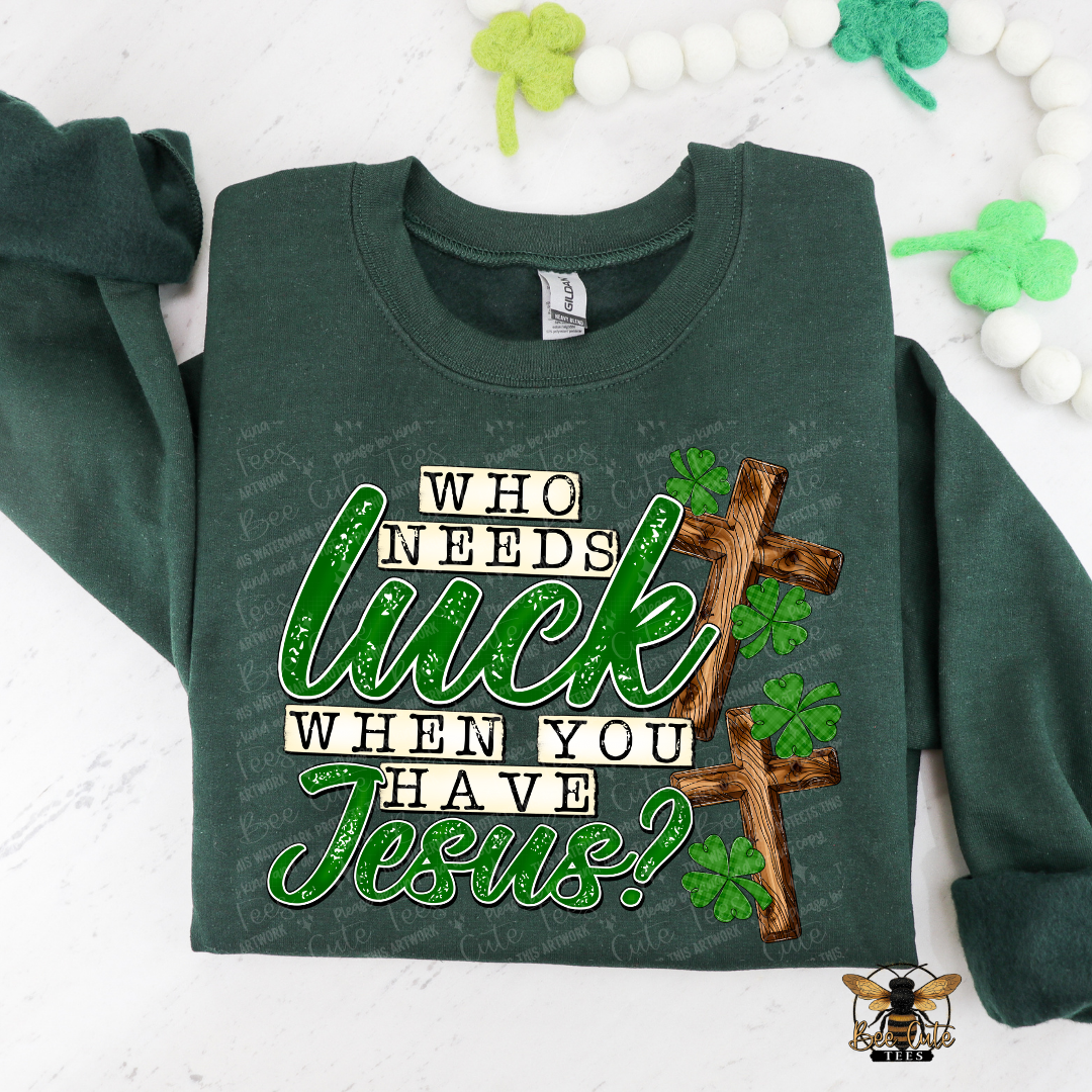 Green sweatshirt with text and cross design on a white background with decorative elements.