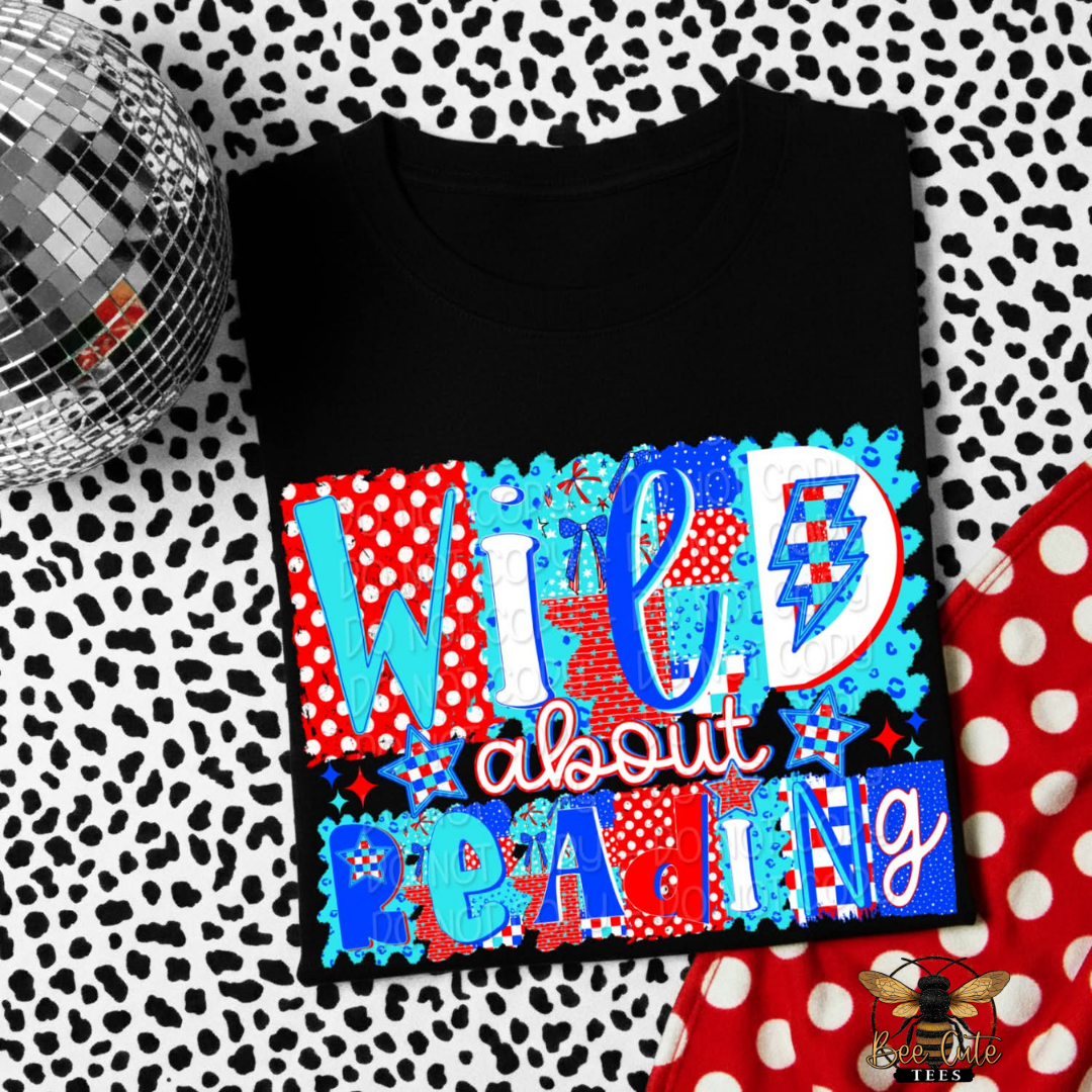 Black t-shirt with colorful text design on a patterned background