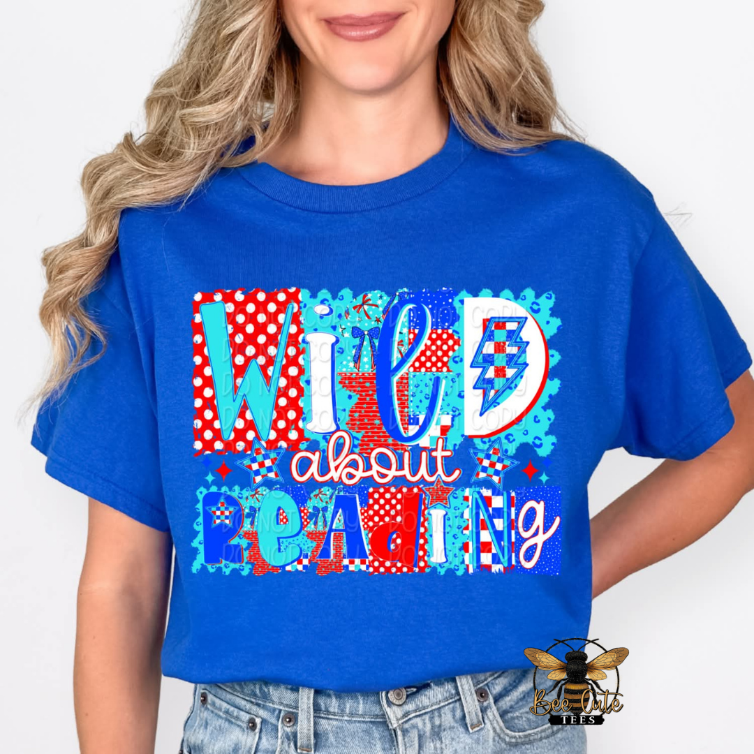 Person wearing a blue t-shirt with colorful text design on a white background