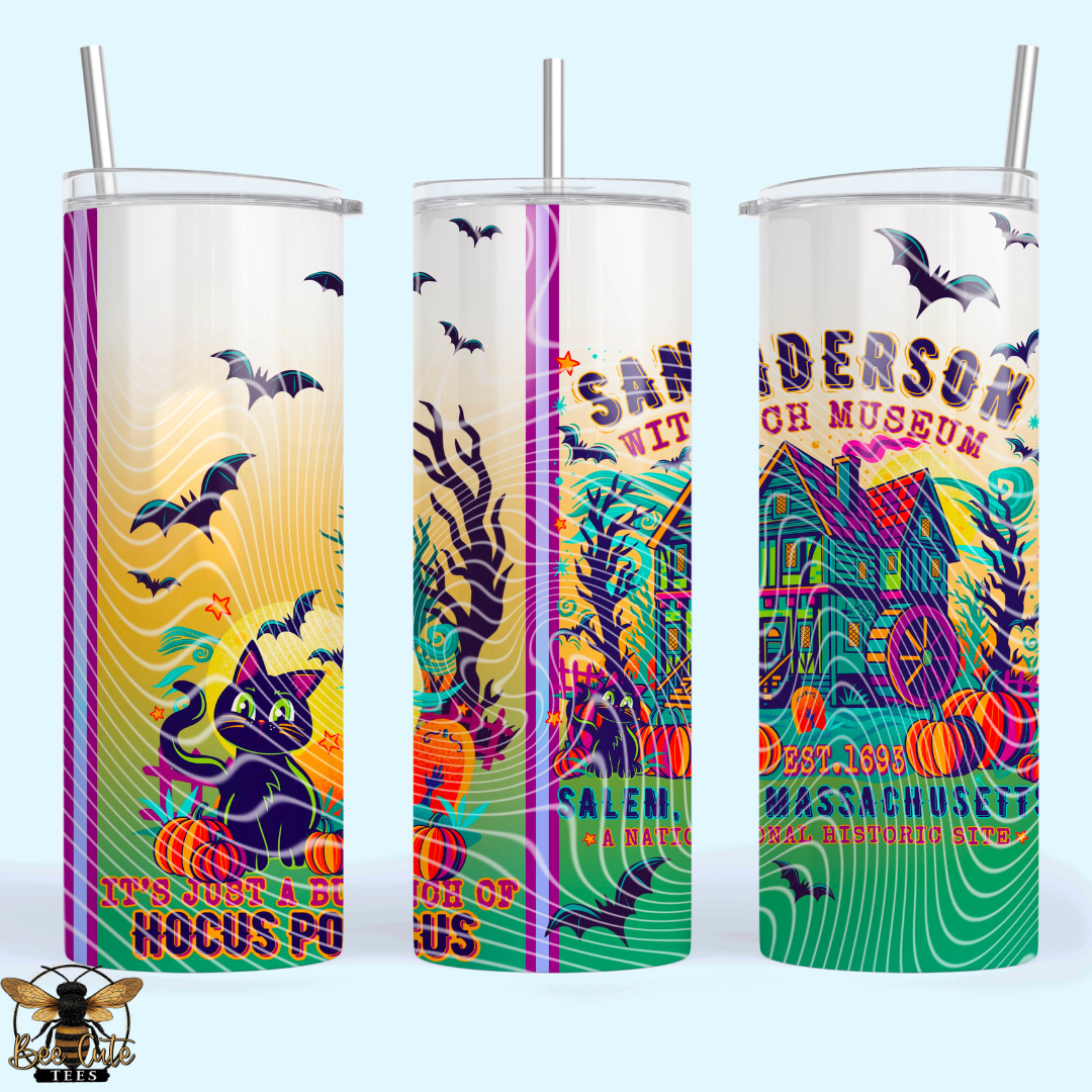 Three tall insulated tumblers with clear lids and metal straws, shown side by side on a pale blue background. Each tumbler features a colorful Halloween-themed graphic with bats, a black cat, pumpkins, a haunted house, and text including 'SAnderson Museum' and 'Halloween Fools'.