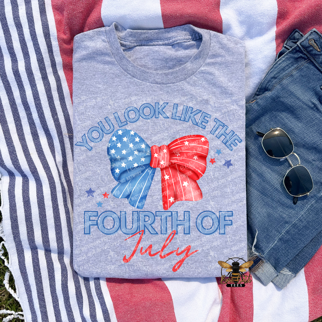 Gray t-shirt with 'You Look Like the Fourth of July' design on an American flag background